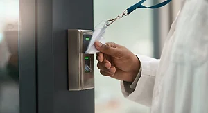 Hand, doctor and machine to scan card for access, secure entry and authentication of restricted area. Person, badge and equipment to verify identity, authorized staff and biosecurity for timekeeping